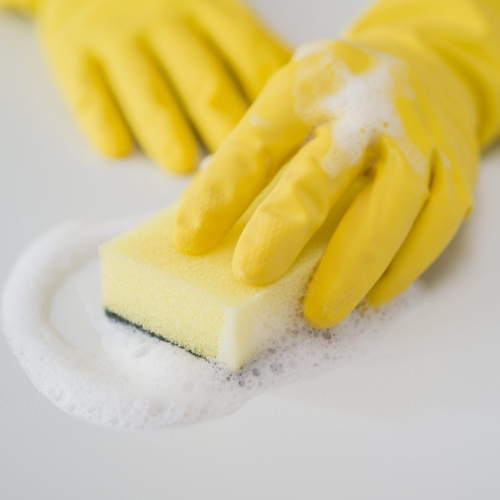 close-up-disinfecting-house-with-sponge
